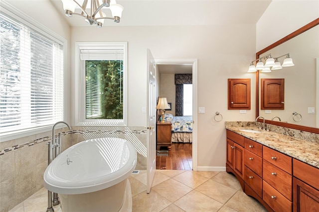 29137 Rocky Point Rd, Polson, MT 59860 - ensuite bathroom with plenty of natural light, a freestanding bath, and vanity