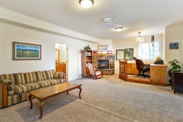 29137 Rocky Point Rd, Polson, MT 59860 - living area with ceiling fan, light carpet, a stone fireplace, and a desk