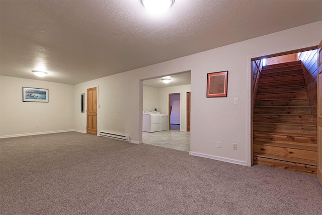 15530 S Sperry Grade Rd, Greenough, MT 59823 - empty room with washing machine and clothes dryer, a baseboard heating unit, carpet flooring, stairs, and baseboards