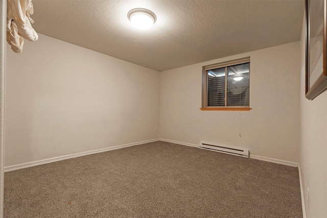 15530 S Sperry Grade Rd, Greenough, MT 59823 - unfurnished room with baseboard heating, carpet flooring, a textured ceiling, and baseboards