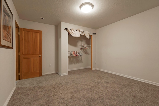 15530 S Sperry Grade Rd, Greenough, MT 59823 - spare room featuring carpet, baseboards, and a textured ceiling