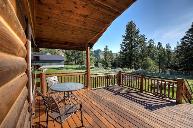 15530 S Sperry Grade Rd, Greenough, MT 59823 - wooden deck with view of scattered trees