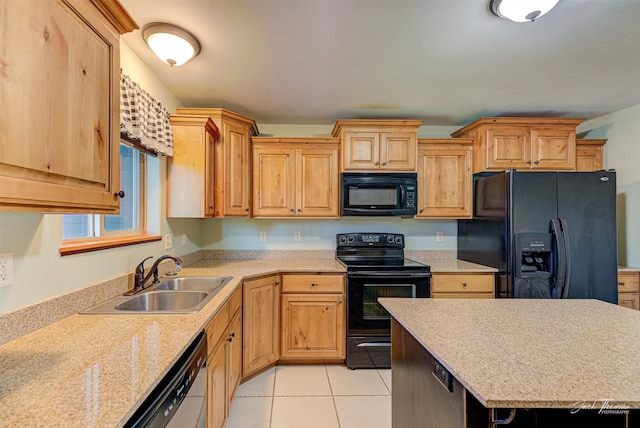 2724 Overlook Blvd, Helena, MT 59601 - kitchen with black appliances, a sink, light tile patterned flooring, and a center island