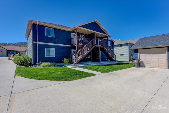 2724 Overlook Blvd, Helena, MT 59601 - view of front of property featuring stairs, concrete driveway, a garage, and a front lawn