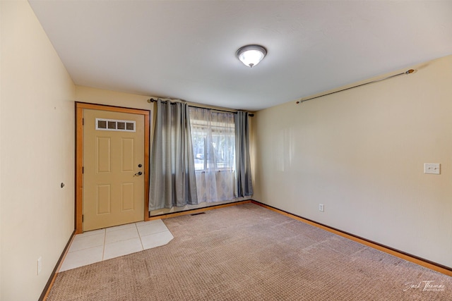 2724 Overlook Blvd, Helena, MT 59601 - spare room with light colored carpet, baseboards, and light tile patterned floors