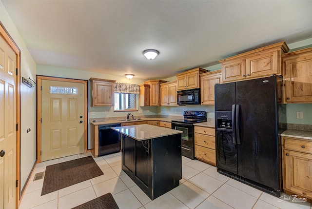 2724 Overlook Blvd, Helena, MT 59601 - kitchen featuring black appliances, a sink, a kitchen island, and light tile patterned floors