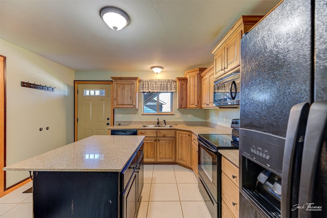 2724 Overlook Blvd, Helena, MT 59601 - kitchen featuring black appliances, a sink, light tile patterned flooring, a center island, and light stone countertops
