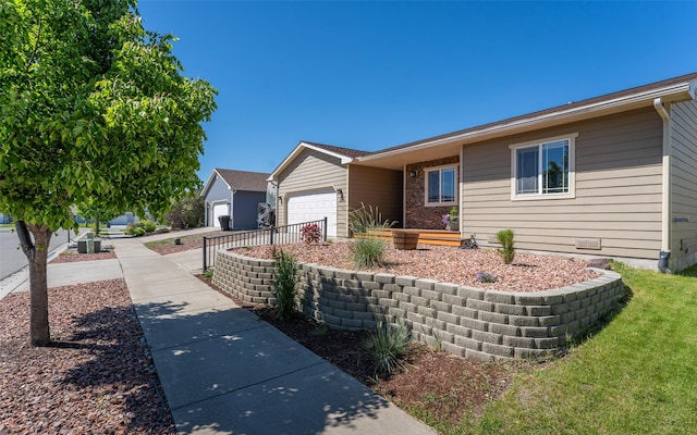 2216 Ruddy Duck Dr, Kalispell, MT 59901 - ranch-style home featuring an attached garage