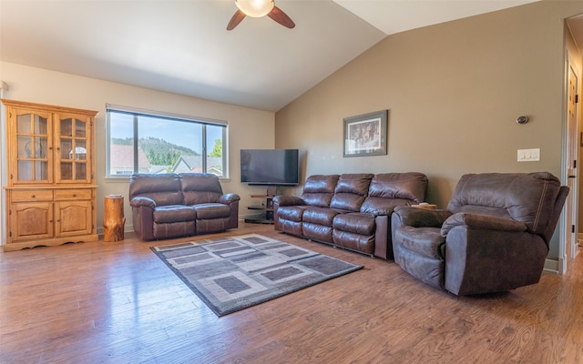 2216 Ruddy Duck Dr, Kalispell, MT 59901 - living room featuring a ceiling fan, lofted ceiling, and light wood-style flooring