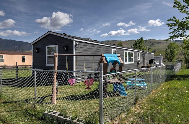 13414 Ashlyn Dr, Missoula, MT 59808 - rear view of house with a mountain view