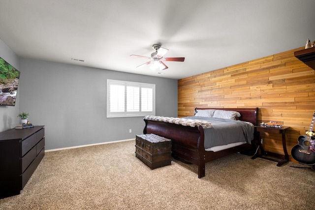 25 Logan Way, Kalispell, MT 59901 - carpeted bedroom with wooden walls and ceiling fan