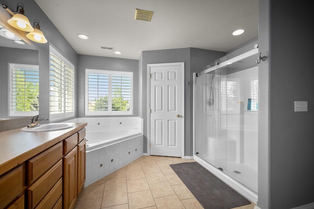 25 Logan Way, Kalispell, MT 59901 - full bathroom with a shower stall, vanity, a bath, tile patterned flooring, and recessed lighting