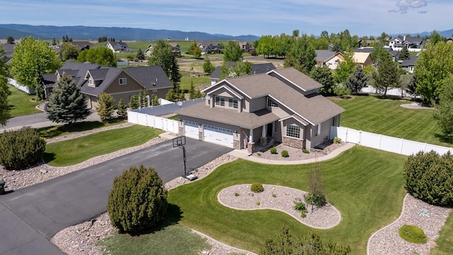 25 Logan Way, Kalispell, MT 59901 - aerial perspective of suburban area with a mountainous background
