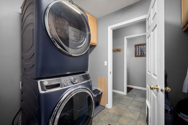 25 Logan Way, Kalispell, MT 59901 - laundry area featuring stacked washer / drying machine and baseboards