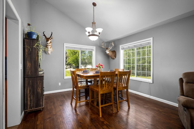 25 Logan Way, Kalispell, MT 59901 - dining room with a chandelier, dark wood-style flooring, and vaulted ceiling