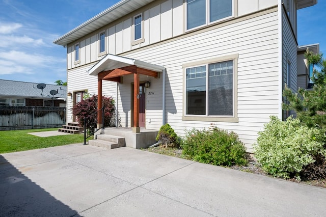 2211 S Russell St Unit B, Missoula, MT 59801 - view of front of house with board and batten siding and a patio area