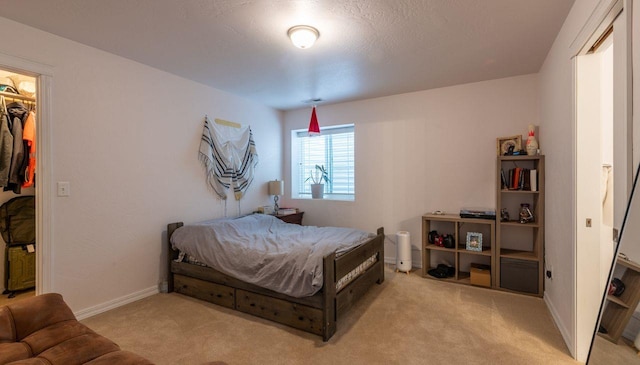 140 Ali Loop, Kalispell, MT 59901 - bedroom featuring light colored carpet and a walk in closet