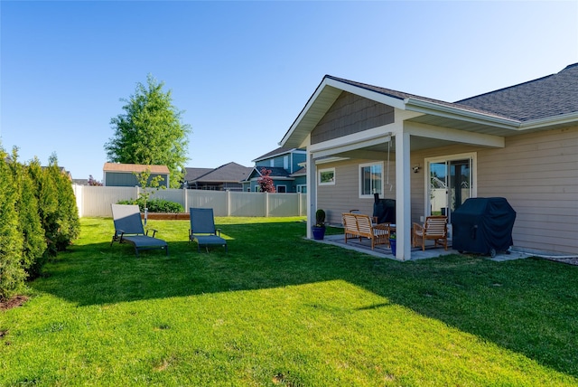 140 Ali Loop, Kalispell, MT 59901 - fenced backyard featuring a patio and an outdoor living space