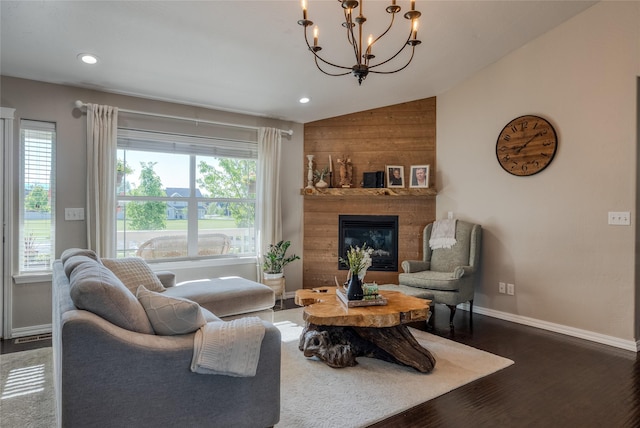 140 Ali Loop, Kalispell, MT 59901 - living area featuring lofted ceiling, a chandelier, a glass covered fireplace, wood finished floors, and recessed lighting
