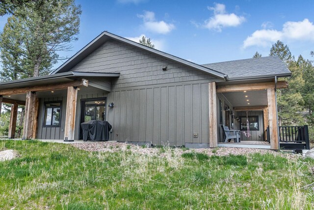 77 Rumsey Rd, Philipsburg, MT 59858 - back of property featuring a shingled roof