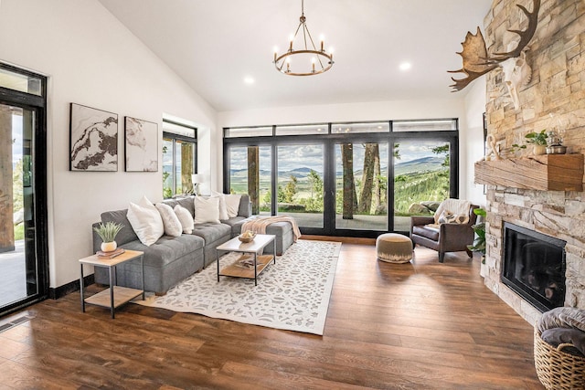 77 Rumsey Rd, Philipsburg, MT 59858 - living area featuring a chandelier, healthy amount of natural light, a fireplace, high vaulted ceiling, and recessed lighting