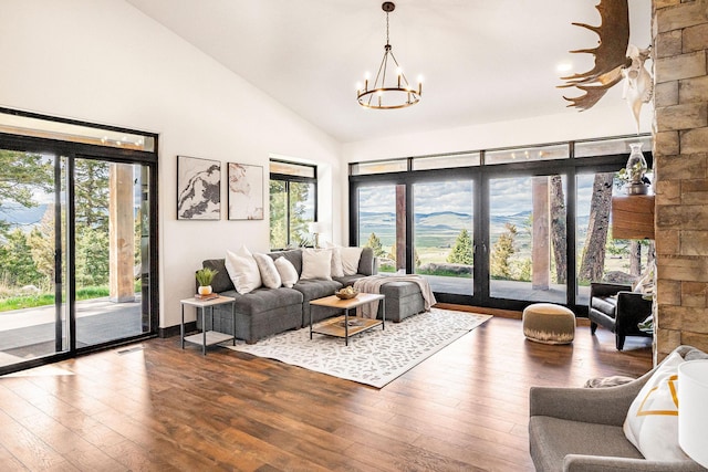 77 Rumsey Rd, Philipsburg, MT 59858 - living room with a chandelier, hardwood / wood-style flooring, and high vaulted ceiling