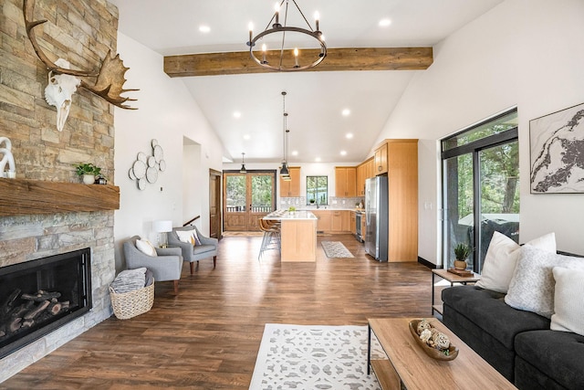 77 Rumsey Rd, Philipsburg, MT 59858 - living room with a chandelier, high vaulted ceiling, plenty of natural light, dark wood finished floors, and recessed lighting