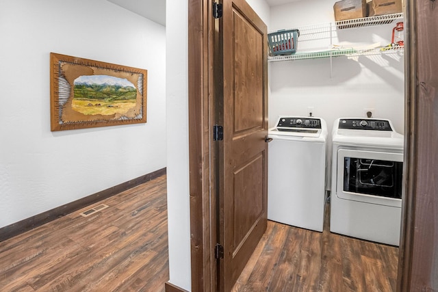 77 Rumsey Rd, Philipsburg, MT 59858 - laundry room with washing machine and dryer, dark wood finished floors, and baseboards