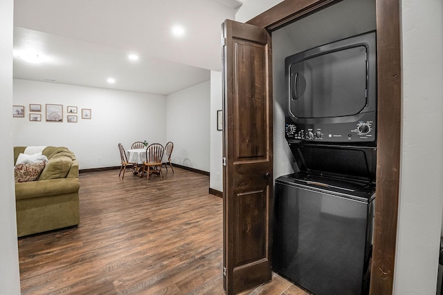 77 Rumsey Rd, Philipsburg, MT 59858 - washroom featuring stacked washing machine and dryer, wood finished floors, baseboards, and recessed lighting
