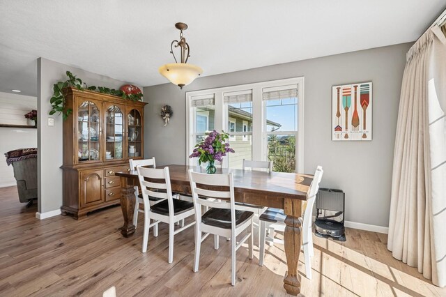 515 Manning Rd, Kalispell, MT 59901 - dining area featuring light wood-type flooring and baseboards