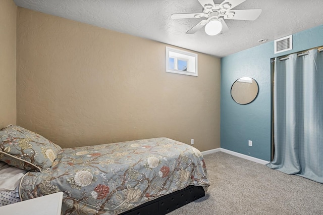 515 Manning Rd, Kalispell, MT 59901 - bedroom featuring a textured ceiling, carpet, a textured wall, ceiling fan, and baseboards