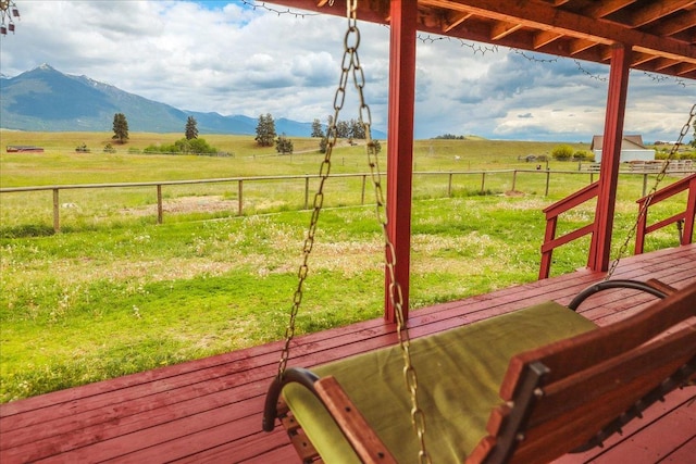 2571 Airport Rd, Eureka, MT 59917 - wooden terrace featuring a rural view and a mountain view