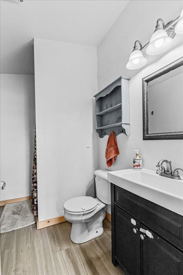 2571 Airport Rd, Eureka, MT 59917 - bathroom featuring wood finished floors and vanity