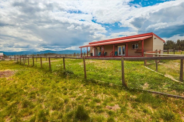 2571 Airport Rd, Eureka, MT 59917 - rear view of house featuring a view of countryside and a mountain view
