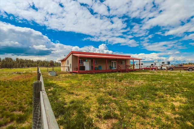 2571 Airport Rd, Eureka, MT 59917 - rear view of house featuring covered porch
