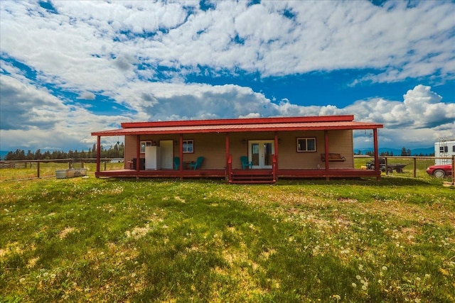 2571 Airport Rd, Eureka, MT 59917 - rear view of property featuring french doors and a wooden deck