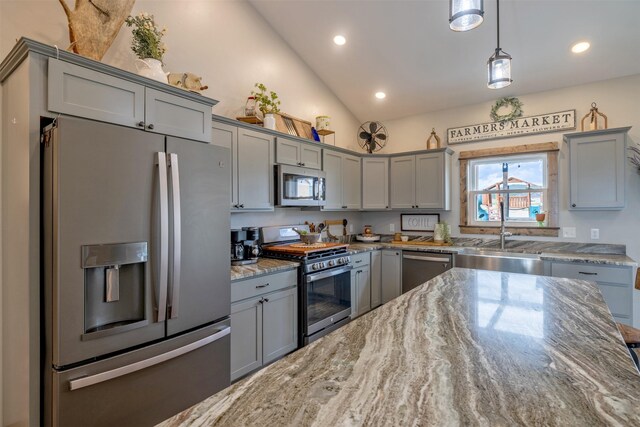 2320 Kenai Rd, Helena, MT 59602 - kitchen with stainless steel appliances, gray cabinetry, a sink, vaulted ceiling, and light stone countertops