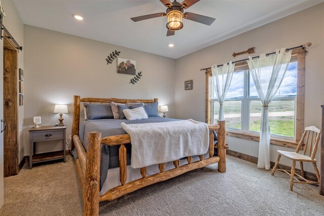 2320 Kenai Rd, Helena, MT 59602 - bedroom featuring carpet flooring, a barn door, recessed lighting, baseboards, and ceiling fan