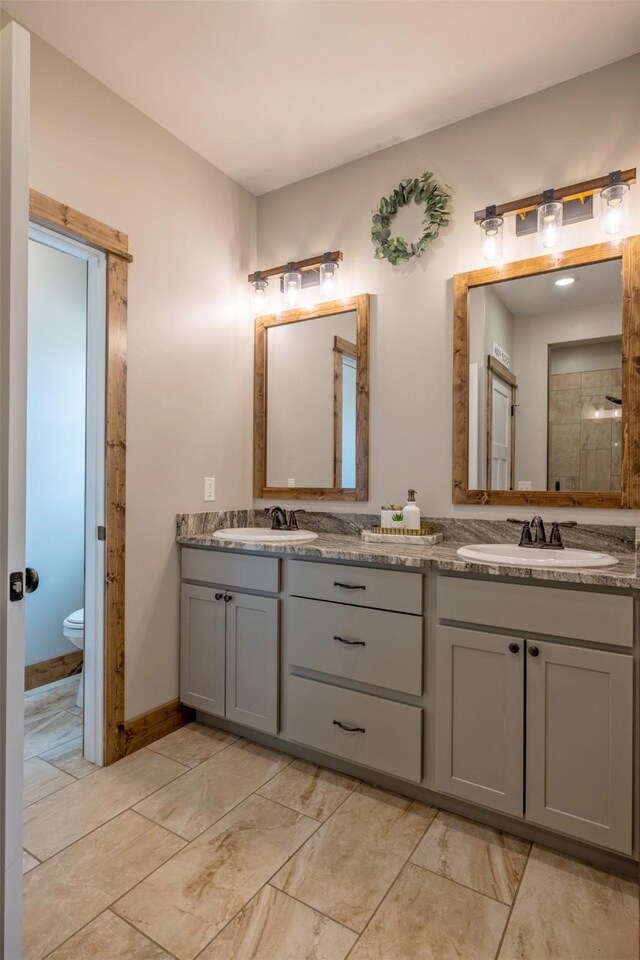 2320 Kenai Rd, Helena, MT 59602 - full bath with double vanity, toilet, and a tile shower