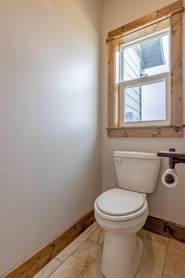 2320 Kenai Rd, Helena, MT 59602 - bathroom featuring baseboards and toilet