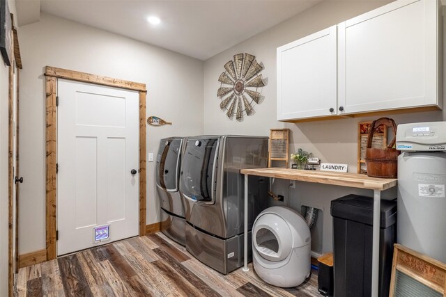 2320 Kenai Rd, Helena, MT 59602 - washroom featuring cabinet space, washer and clothes dryer, wood finished floors, baseboards, and recessed lighting