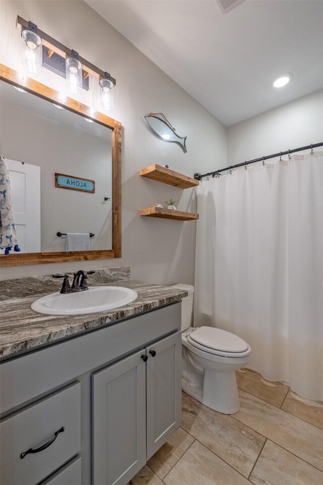 2320 Kenai Rd, Helena, MT 59602 - full bathroom featuring vanity and toilet