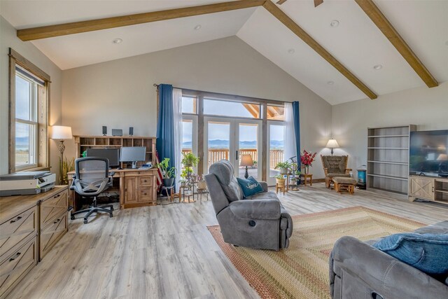 2320 Kenai Rd, Helena, MT 59602 - living area featuring high vaulted ceiling, a desk, light wood finished floors, beamed ceiling, and healthy amount of natural light
