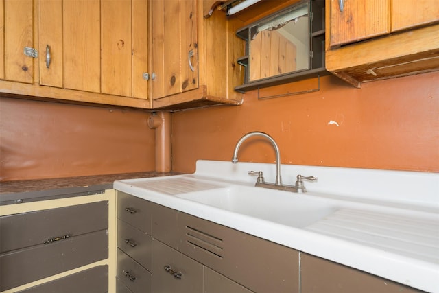 505 Oak St, Anaconda, MT 59711 - kitchen featuring gray cabinetry, open shelves, and a sink