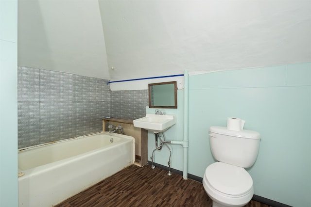 505 Oak St, Anaconda, MT 59711 - bathroom with a bath, toilet, wood finished floors, and tile walls