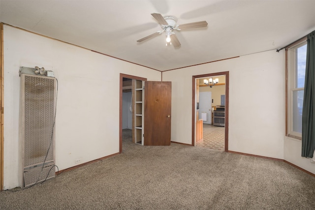 505 Oak St, Anaconda, MT 59711 - unfurnished bedroom featuring a heating unit, carpet floors, a chandelier, baseboards, and ceiling fan