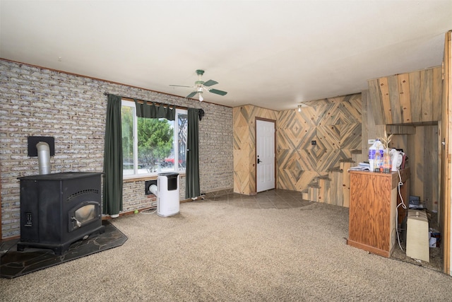 505 Oak St, Anaconda, MT 59711 - unfurnished living room with ceiling fan, carpet, and a wood stove