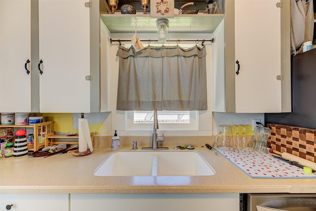 1202 Walnut St, Helena, MT 59601 - kitchen featuring a sink, light countertops, white cabinets, and beverage cooler