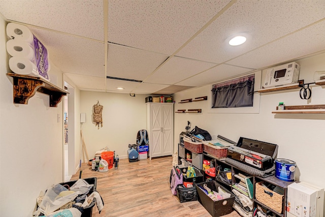 1202 Walnut St, Helena, MT 59601 - rec room featuring light wood-style floors, a drop ceiling, and recessed lighting