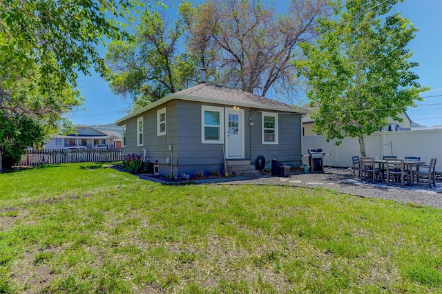 1202 Walnut St, Helena, MT 59601 - back of house with entry steps and a patio area